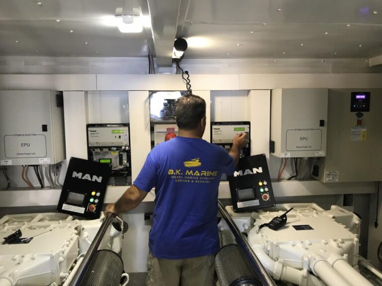 Technician servicing MAN engines in the engine room